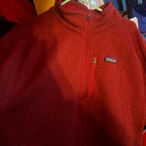 patagonia men’s xxl sweater. zipper. zipper pouch on left chest.